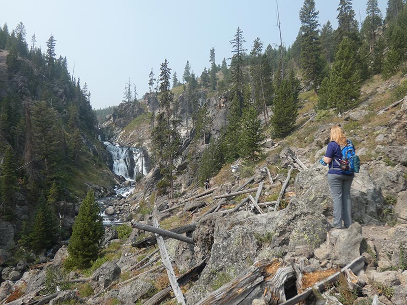 girl-hiking-mystic-falls-in-yellowstone