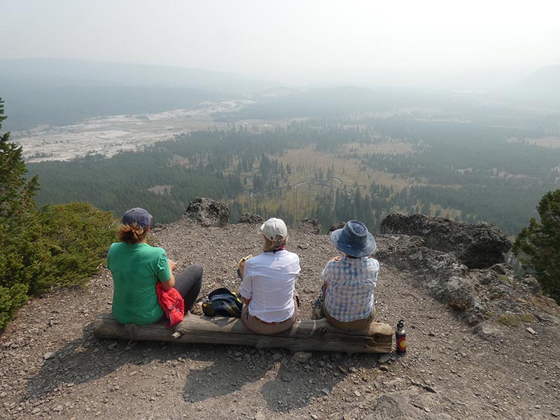 people-enjoying-beautiful-view-of-yellowstone-during-hike