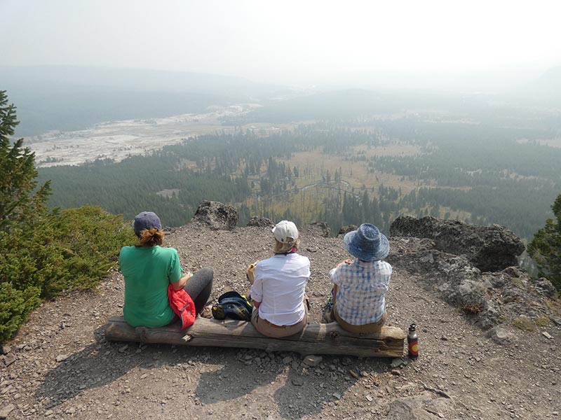 people-enjoying-mystic-falls-biscuit-basin-beautiful-view